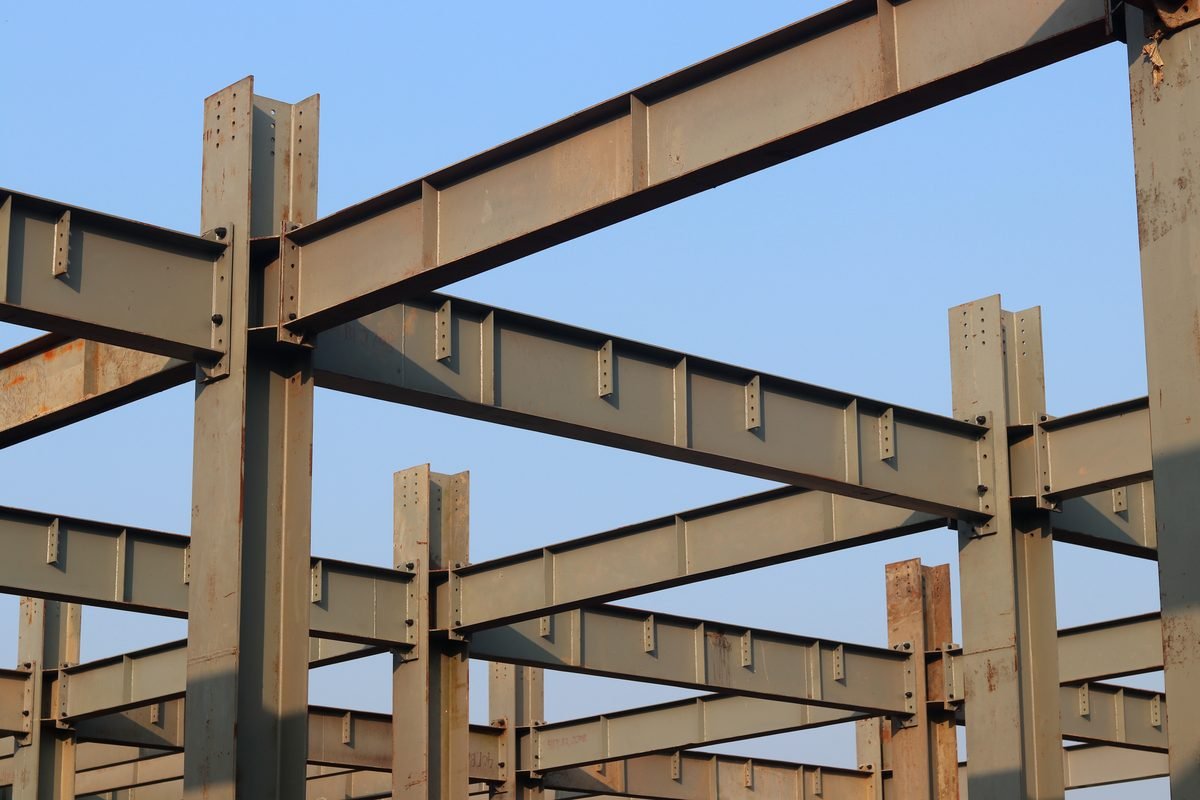 Bolted moment connections on fabricated steel rafters and columns of a SteelCraft PEB frame